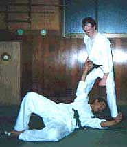 Photograph 4. Turning the hips to the right, throw the opponent down. Possible follow ups can include a well placed strike or kick, a joint lock, or similar technique of subjugation.